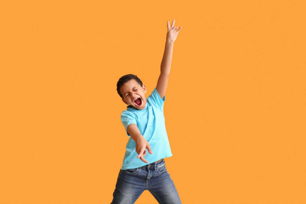 Boy dancing and singing